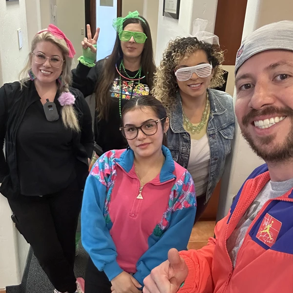 The Buena Vida Dental team dressed in party costumes
