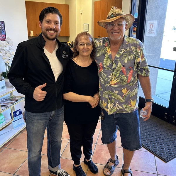 Dr. Carlos with two happy elderly patients